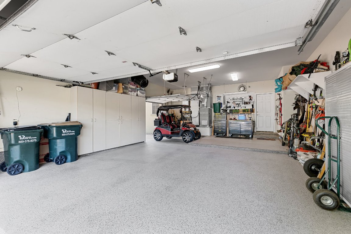 103 Trail Rider Way Georgetown, TX 78633 - Photo 37 of 39 a view of a garage with a bike and car