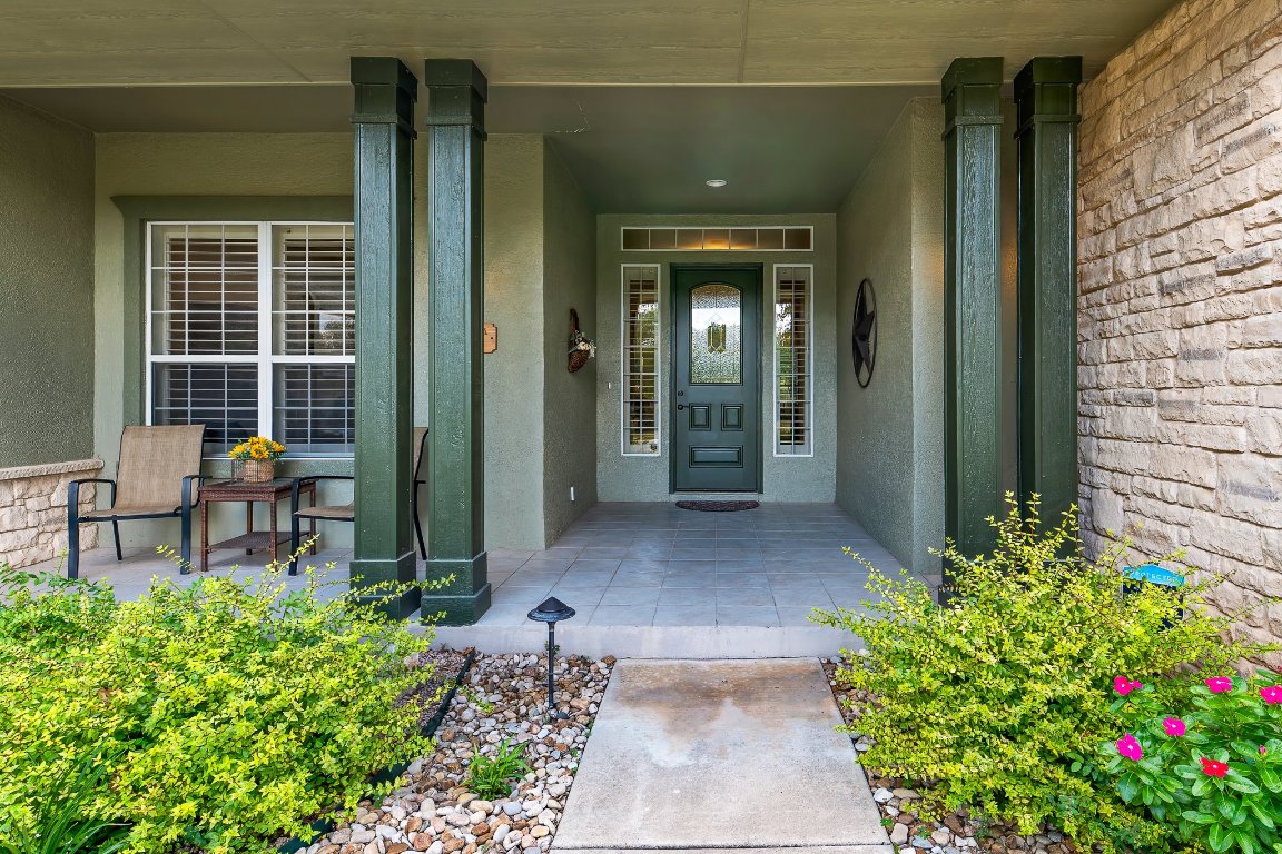 103 Trail Rider Way Georgetown, TX 78633 - Photo 8 of 39 a view of a porch with chairs and potted plants