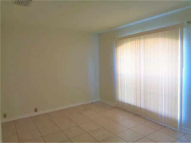 a bathroom with a bathtub sink vanity and shower