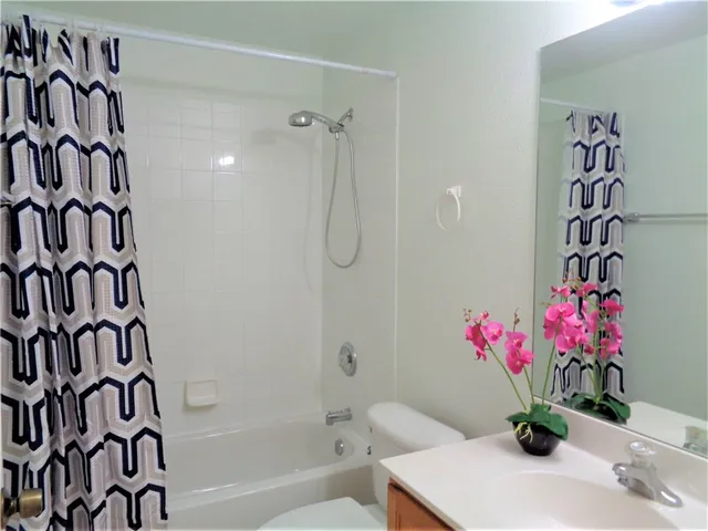 a view of a room with air conditioner and window