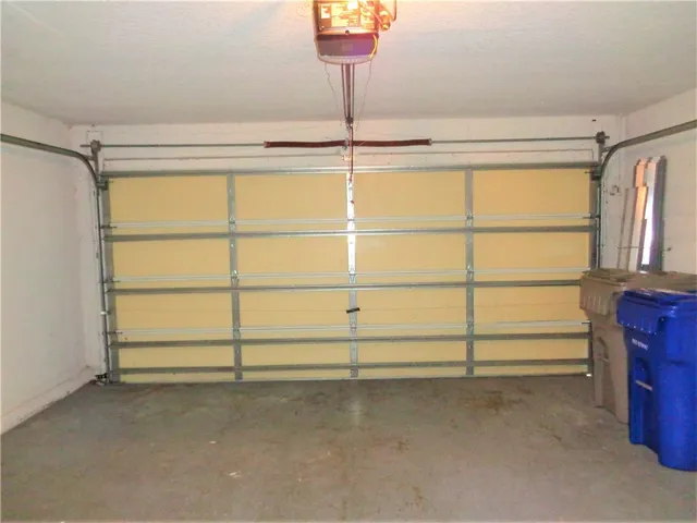 a view of a swimming pool and trees in the background