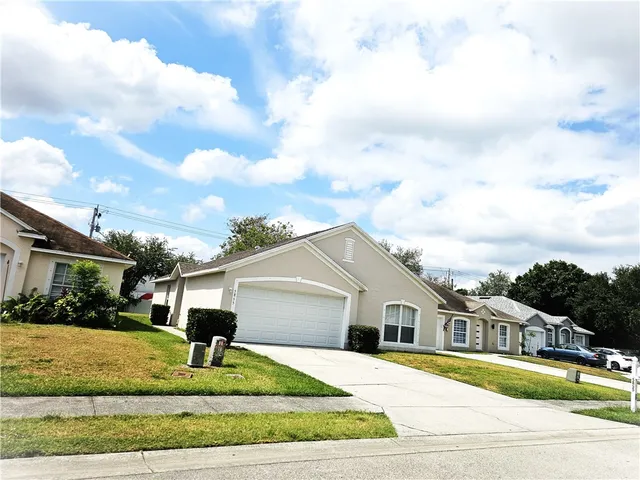 a front view of a building with garage