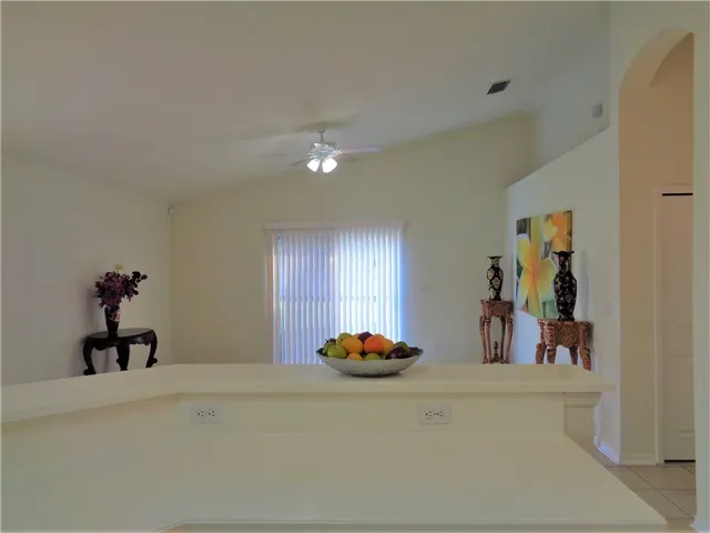 a kitchen with stainless steel appliances granite countertop a sink cabinets and a refrigerator