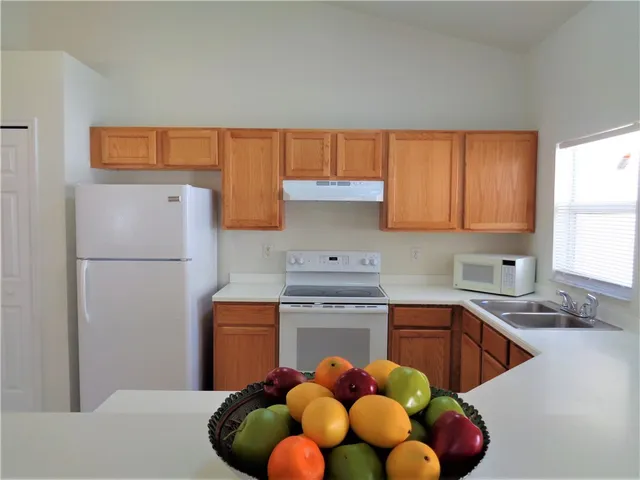 a view of a room with toys and chandelier