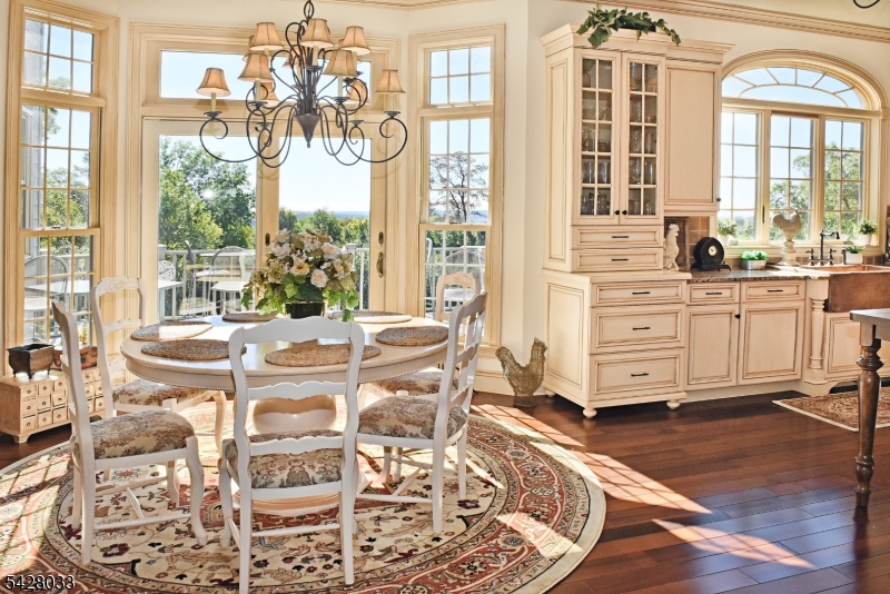 2 Chilton Road Chester, NJ 07930 - Photo 8 of 43 a view of a dining room with furniture wooden floor and a chandelier