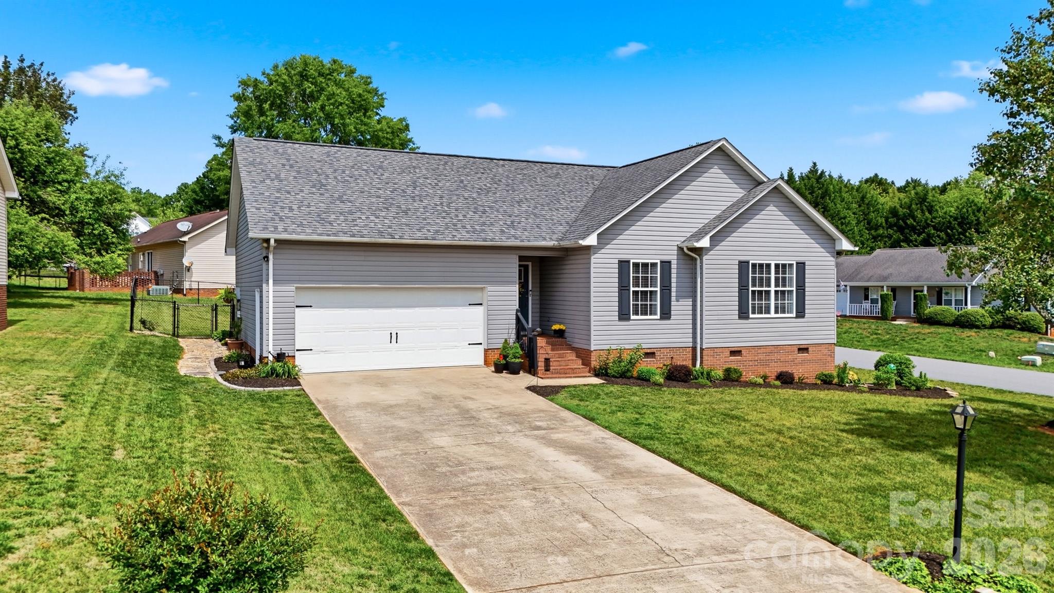 2104 Sheffield Court Northwest Conover, NC 28613 - Photo 2 of 25 a front view of a house with a yard