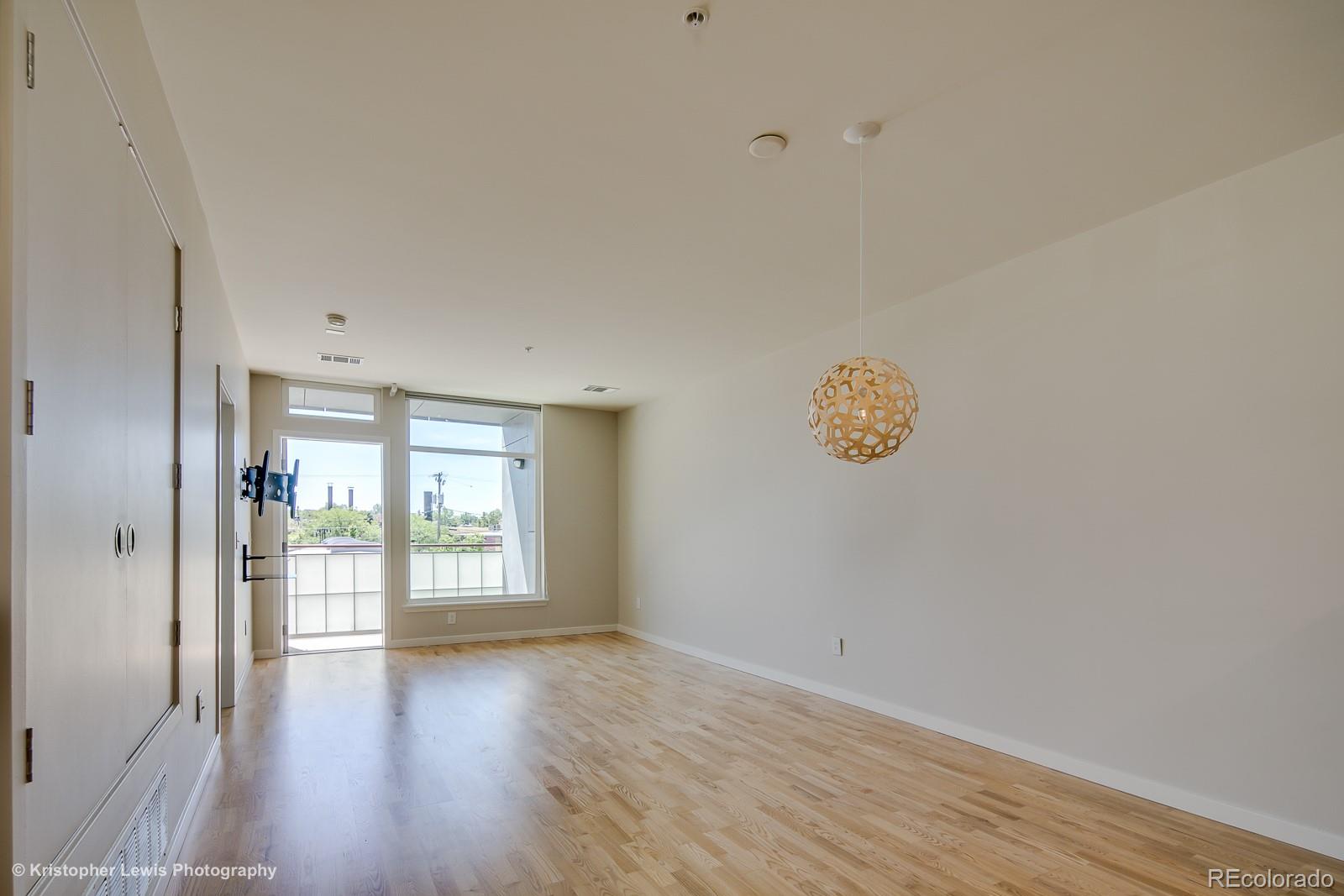 3101 Blake Street, Unit 308 Denver, CO 80205 - Photo 6 of 19 a view of an empty room with a window