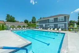 a view of house and outdoor space with swimming pool