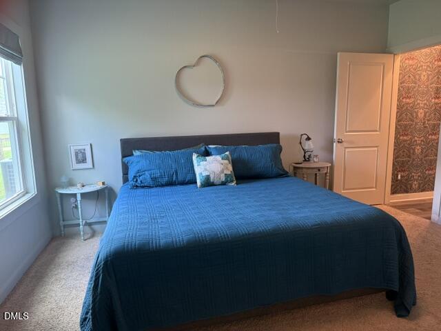 574 East Ridge Avenue Liberty, NC 27298 - Photo 18 of 28 a bedroom with a bed and window