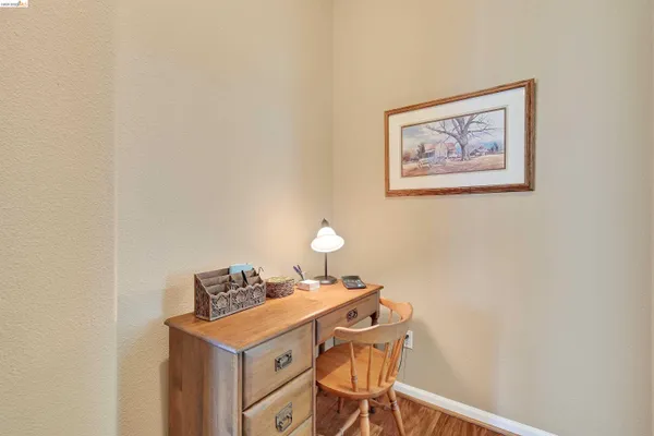 a view of a workspace with furniture