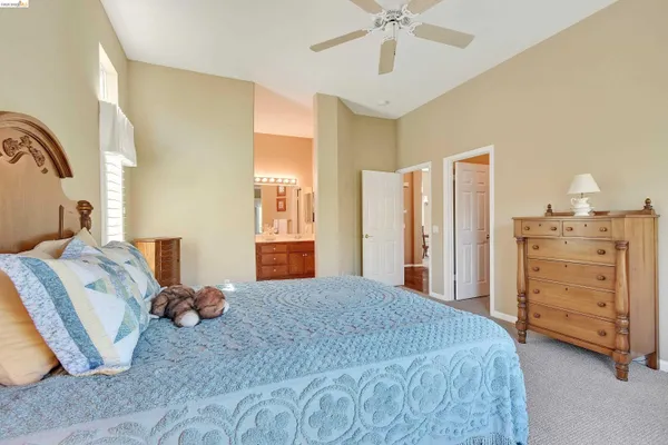 a bedroom with a bed and a cabinets