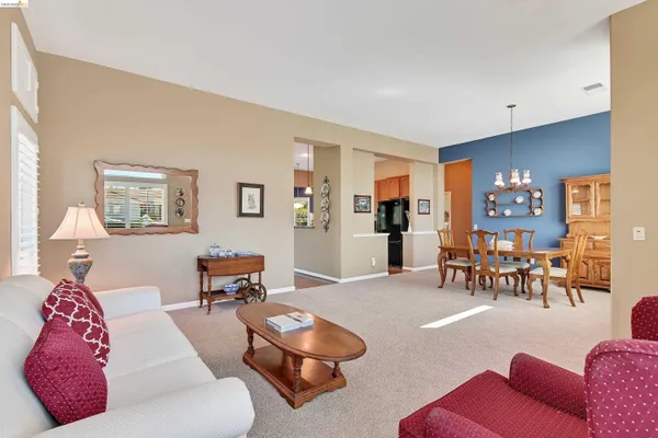 a living room with furniture and a table
