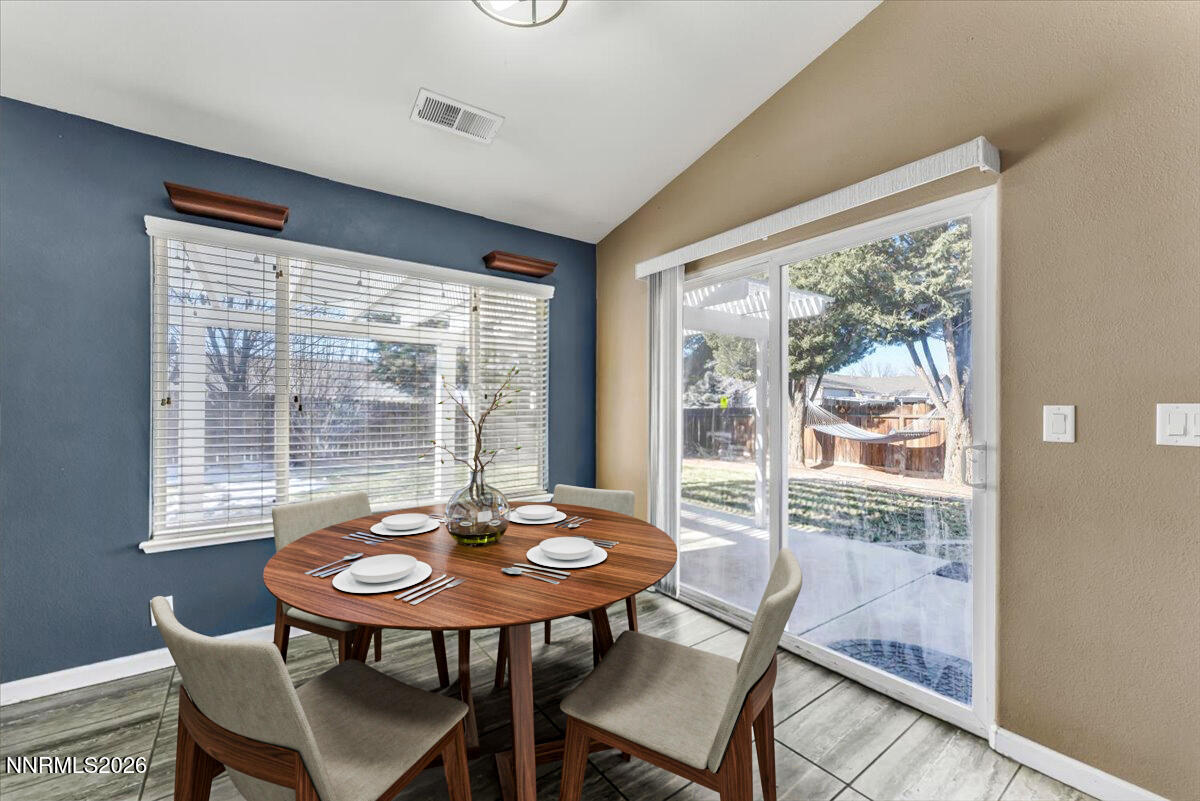 7663 La Ramba Drive Sparks, NV 89436 - Photo 13 of 27 a view of a room with a table and chairs