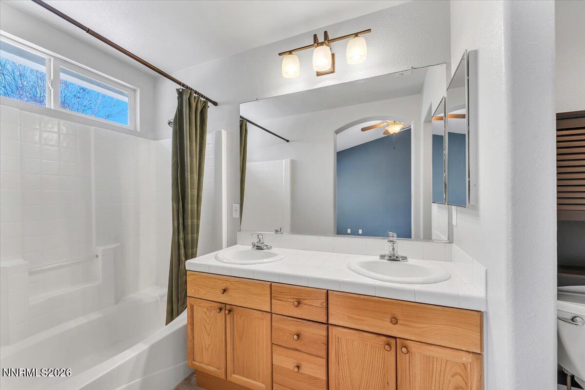 7663 La Ramba Drive Sparks, NV 89436 - Photo 16 of 27 a bathroom with a double vanity sink mirror and double