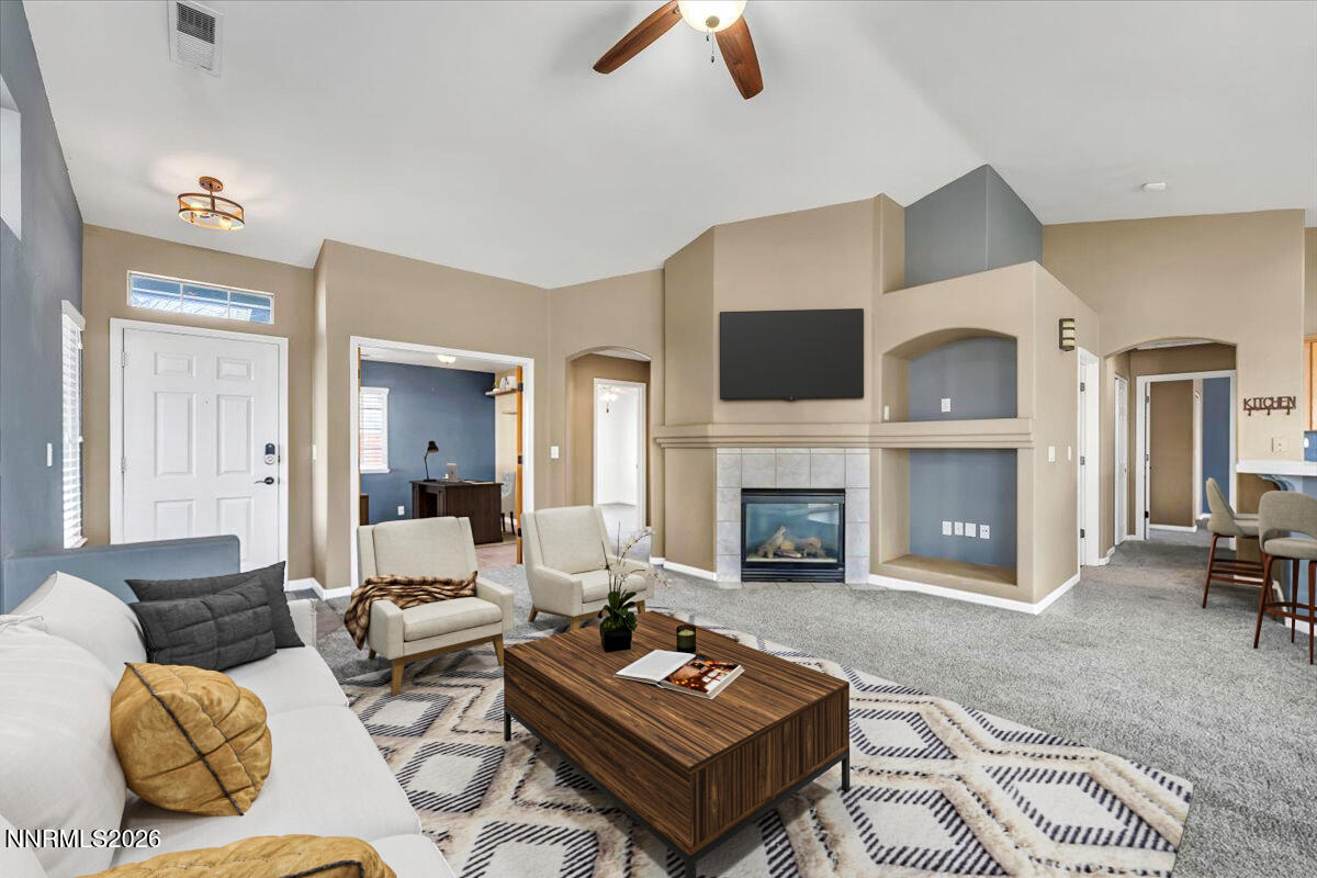 7663 La Ramba Drive Sparks, NV 89436 - Photo 5 of 27 a living room with furniture and a fireplace
