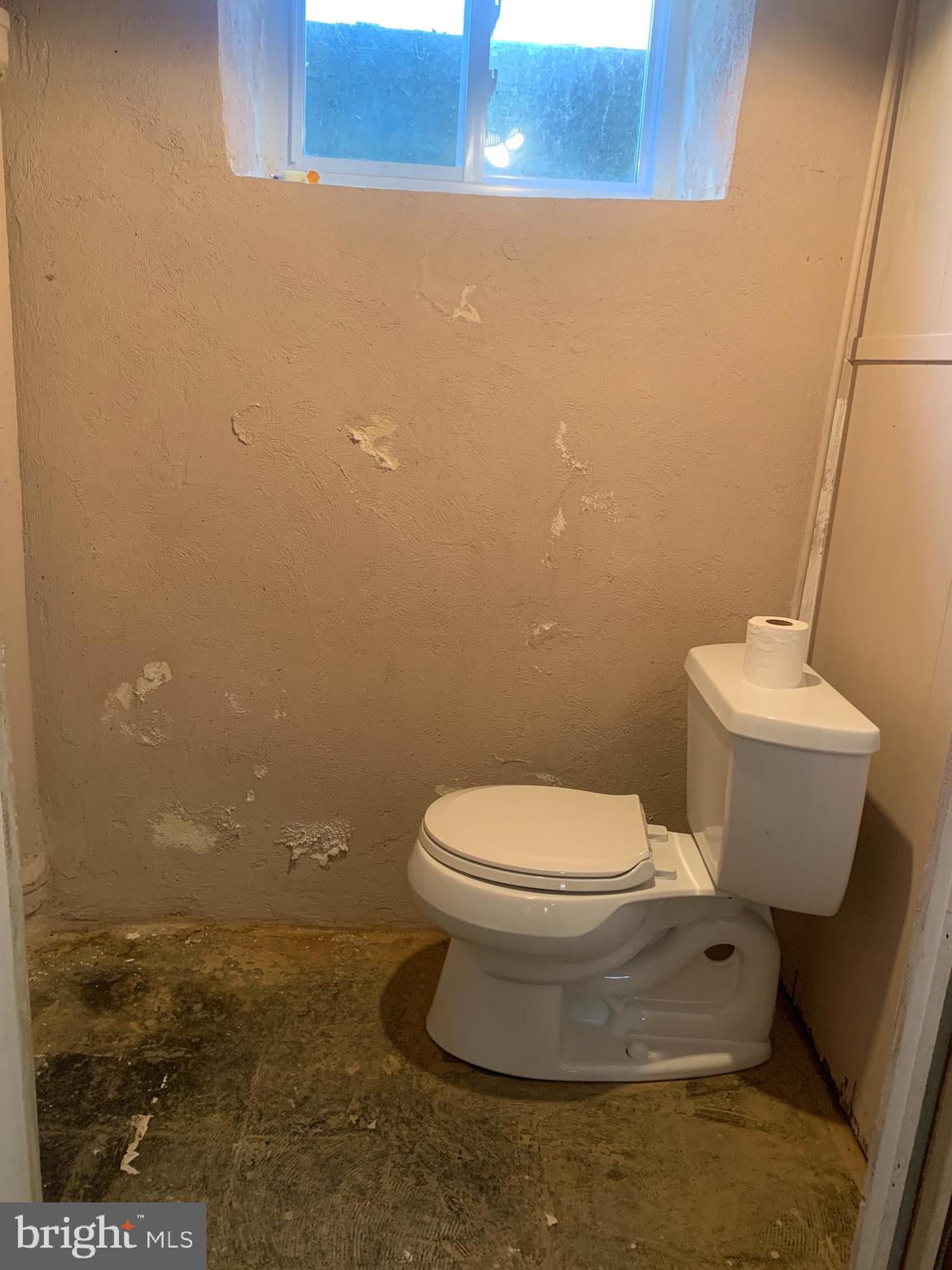 640 Laurel Road Springfield, PA 19064 - Photo 20 of 30 a white toilet sitting next to a sink