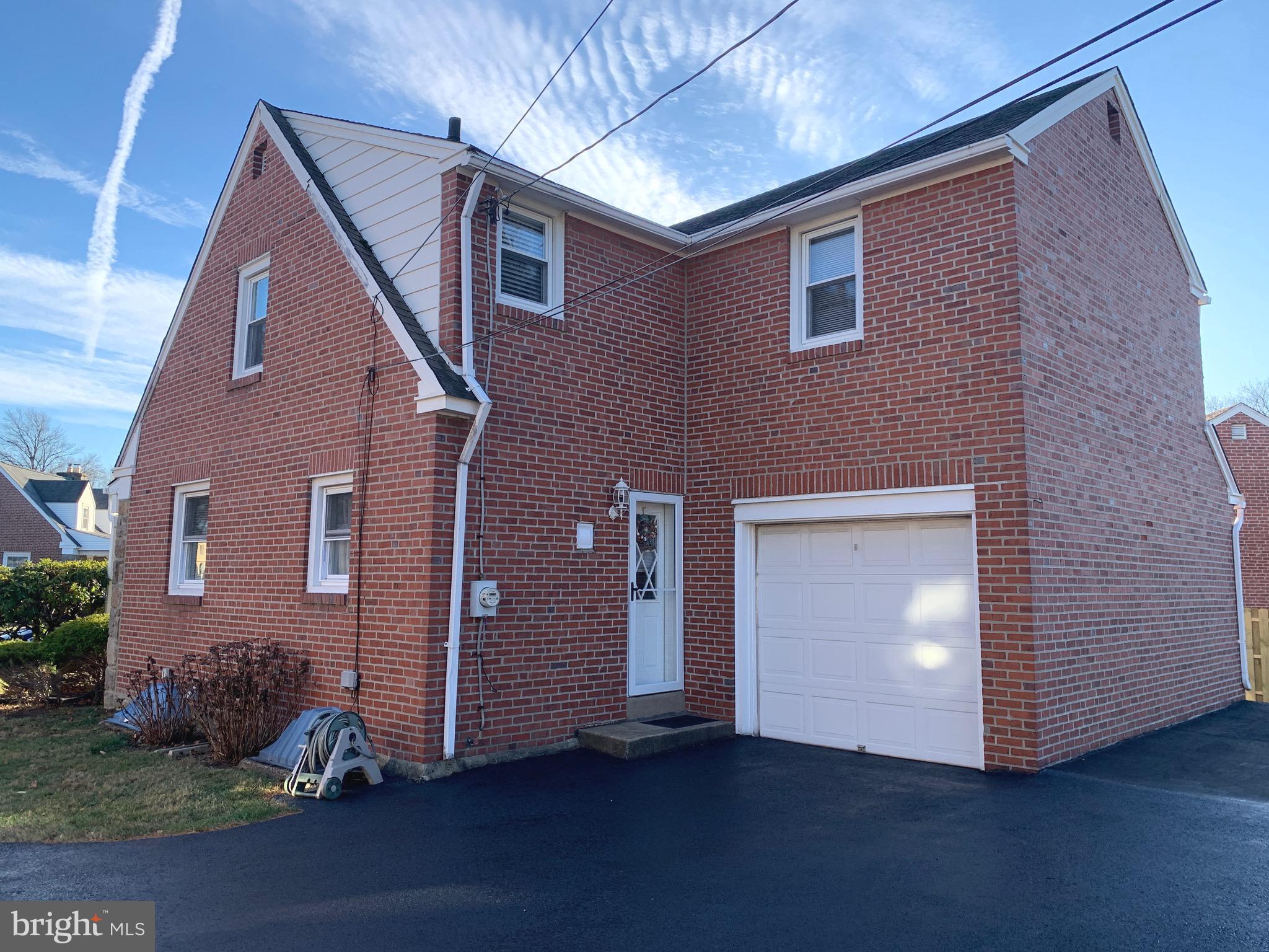 640 Laurel Road Springfield, PA 19064 - Photo 26 of 30 a front view of a house with a yard