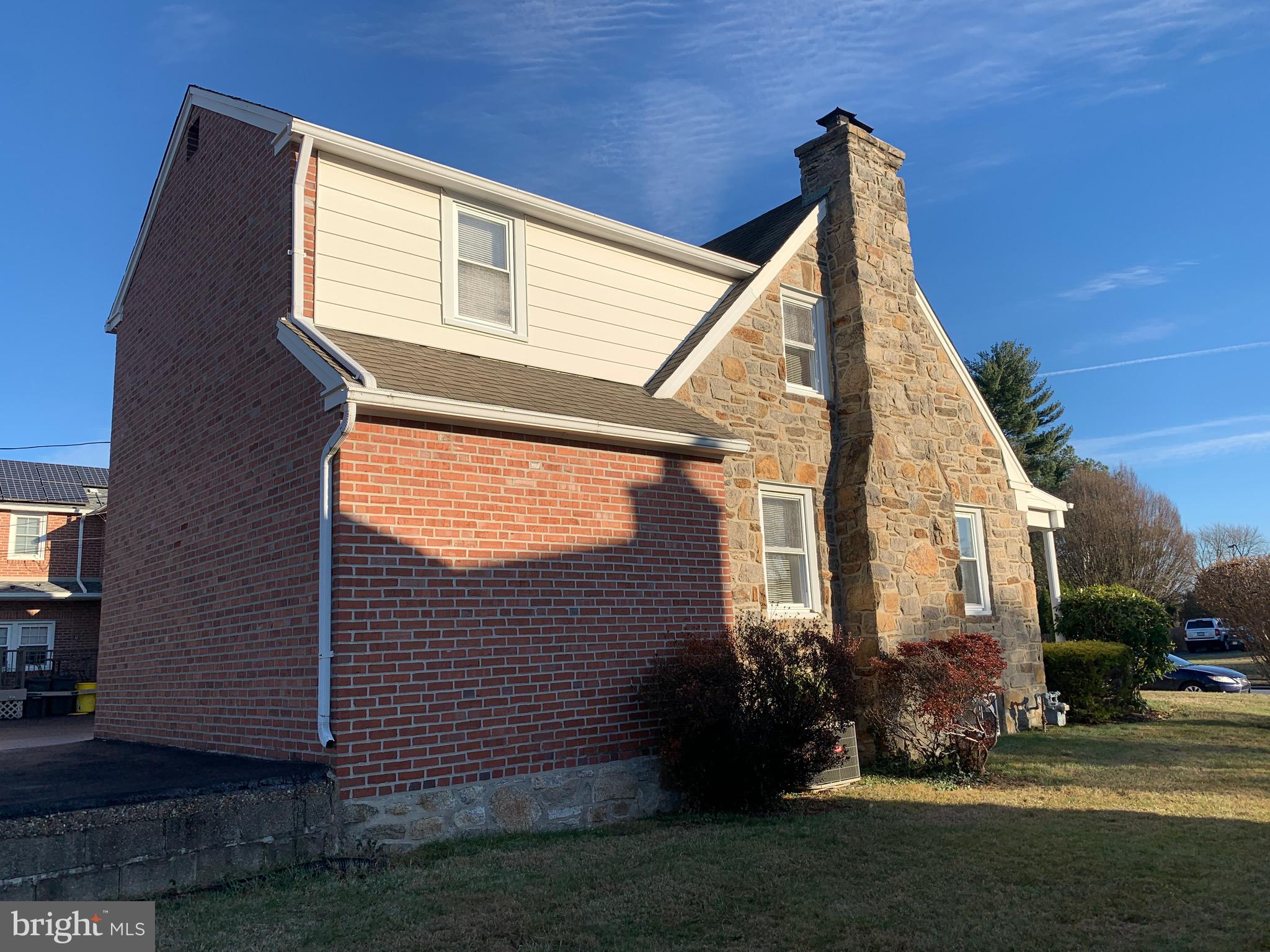 640 Laurel Road Springfield, PA 19064 - Photo 27 of 30 a view of a house with brick walls and a yard