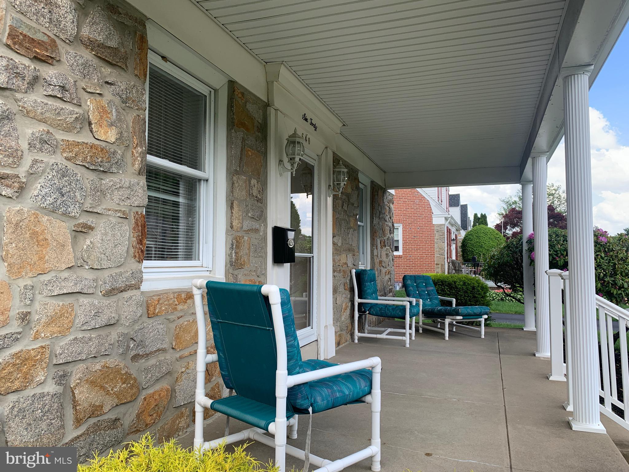 640 Laurel Road Springfield, PA 19064 - Photo 3 of 30 a view of a patio with table and chairs and potted plants