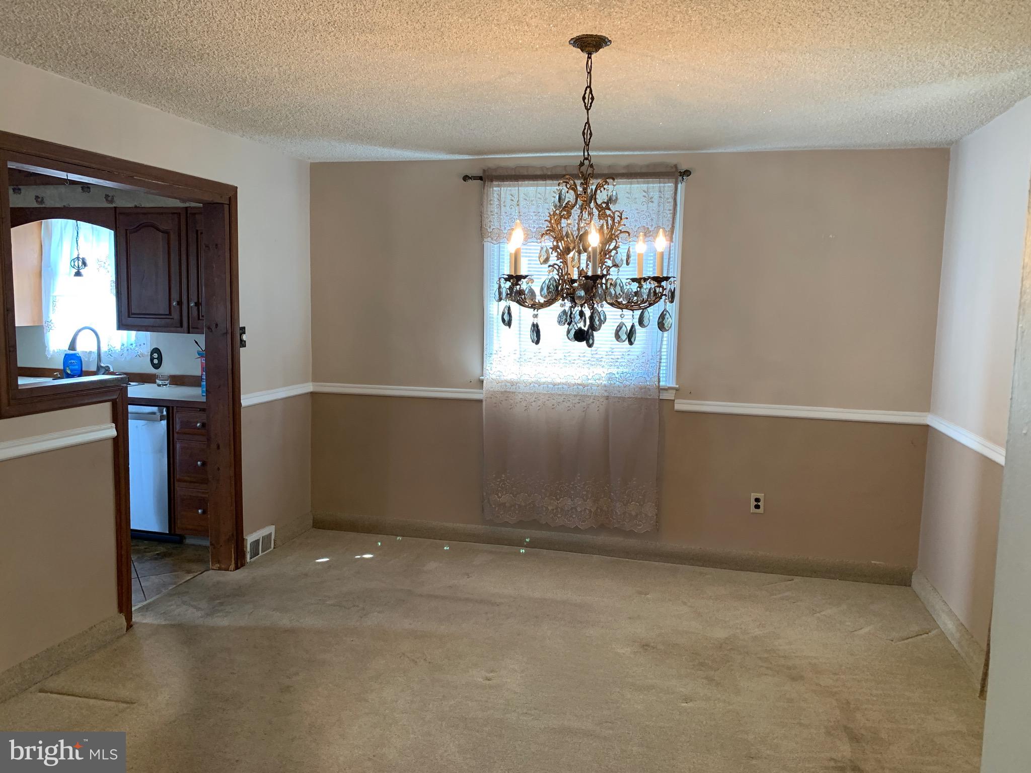 640 Laurel Road Springfield, PA 19064 - Photo 7 of 30 a view of a room with window and chandelier