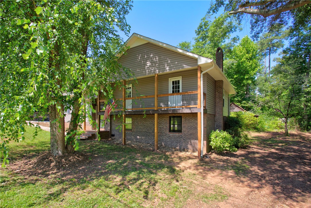 712 Beech Drive Seneca, SC 29678 - Photo 1 of 41 A private elevated porch offers outdoor living in a naturally shaded setting.