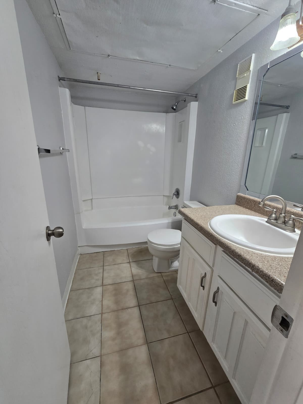 4747 Allendale Road, Unit 38 Houston, TX 77017 - Photo 12 of 15 a bathroom with a granite countertop sink a toilet and shower