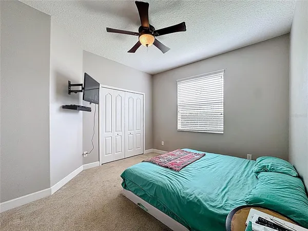 a room with pool table and flat screen tv