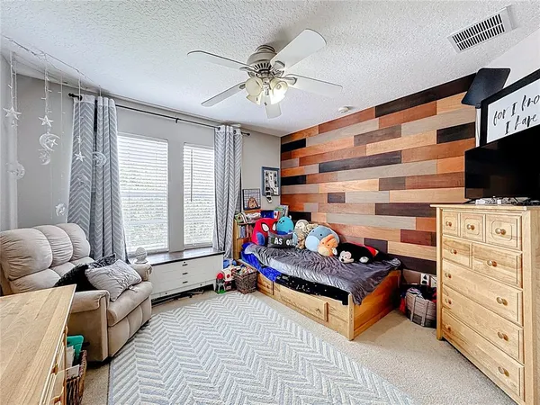 a bed room with a bed and a dresser