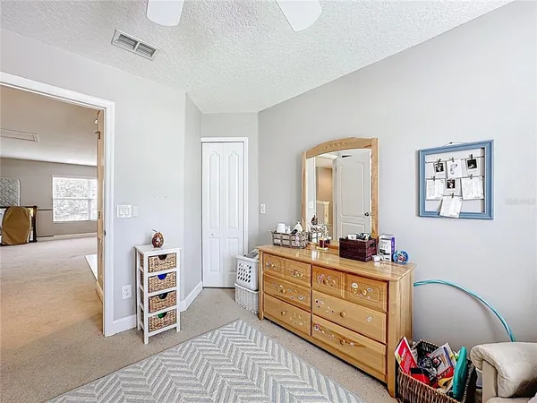 a spacious bathroom with a double vanity sink mirror and a bathtub