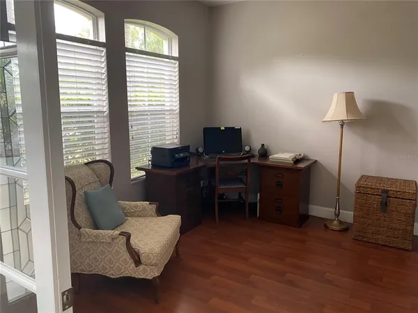 a kitchen with stainless steel appliances granite countertop a sink dishwasher stove and refrigerator with wooden floor