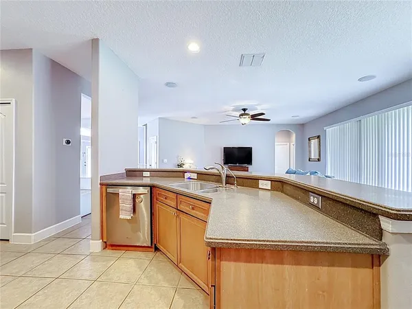 a kitchen with a sink appliances and cabinets