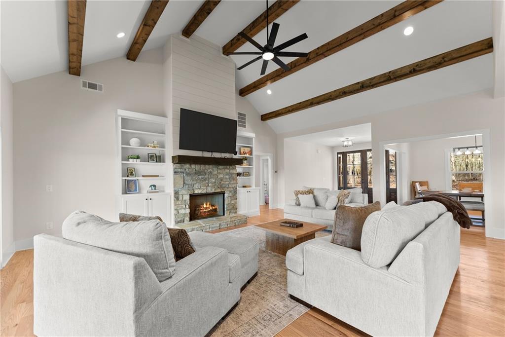 201 Fred Pitts Road Demorest, GA 30535 - Photo 16 of 55 a living room with furniture a fireplace and a flat screen tv