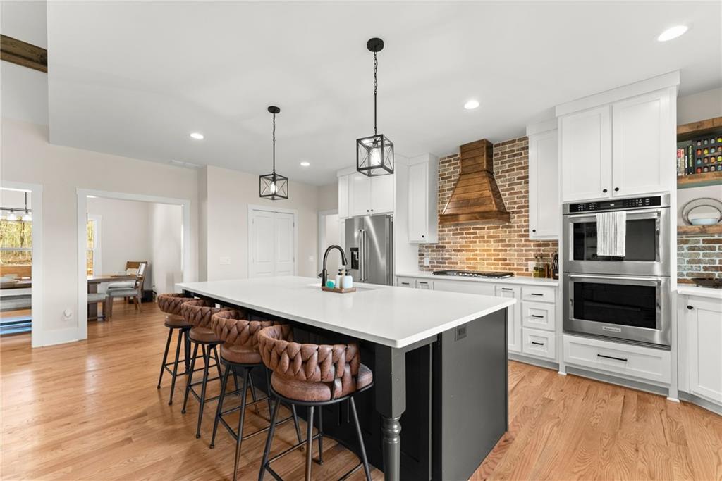 201 Fred Pitts Road Demorest, GA 30535 - Photo 17 of 55 a open kitchen with a table and chairs in it