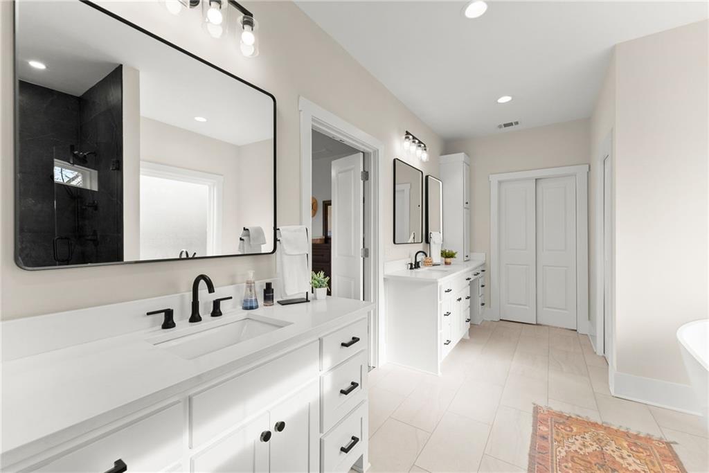 201 Fred Pitts Road Demorest, GA 30535 - Photo 28 of 55 a bathroom with double vanity sink and mirror