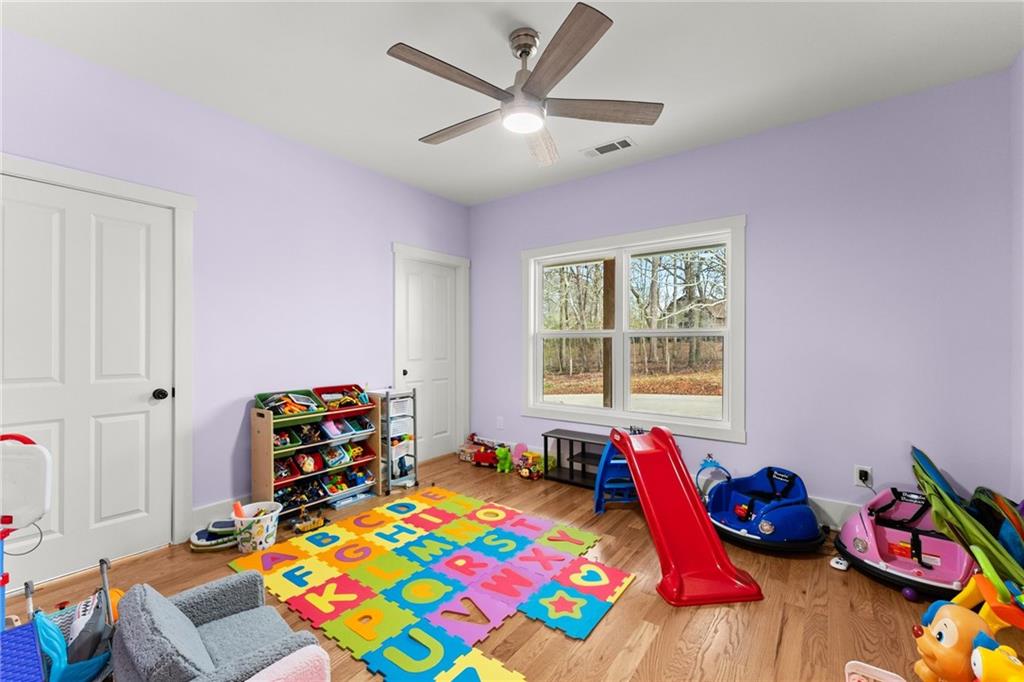 201 Fred Pitts Road Demorest, GA 30535 - Photo 31 of 55 a bedroom with a bed and a wooden floor