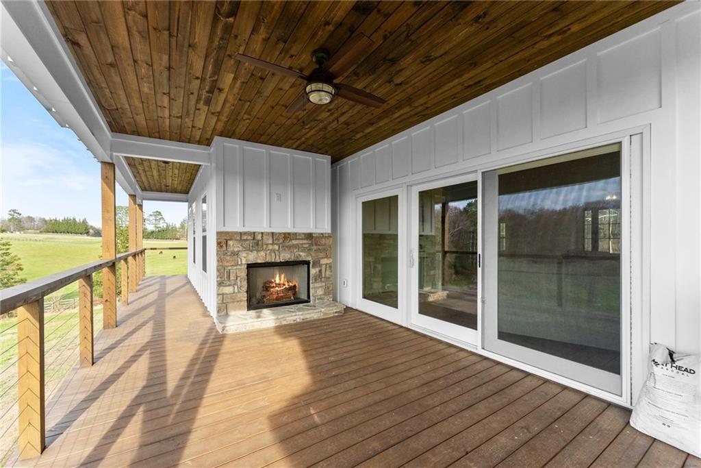 201 Fred Pitts Road Demorest, GA 30535 - Photo 4 of 55 a view of an empty room with wooden floor fireplace and a window