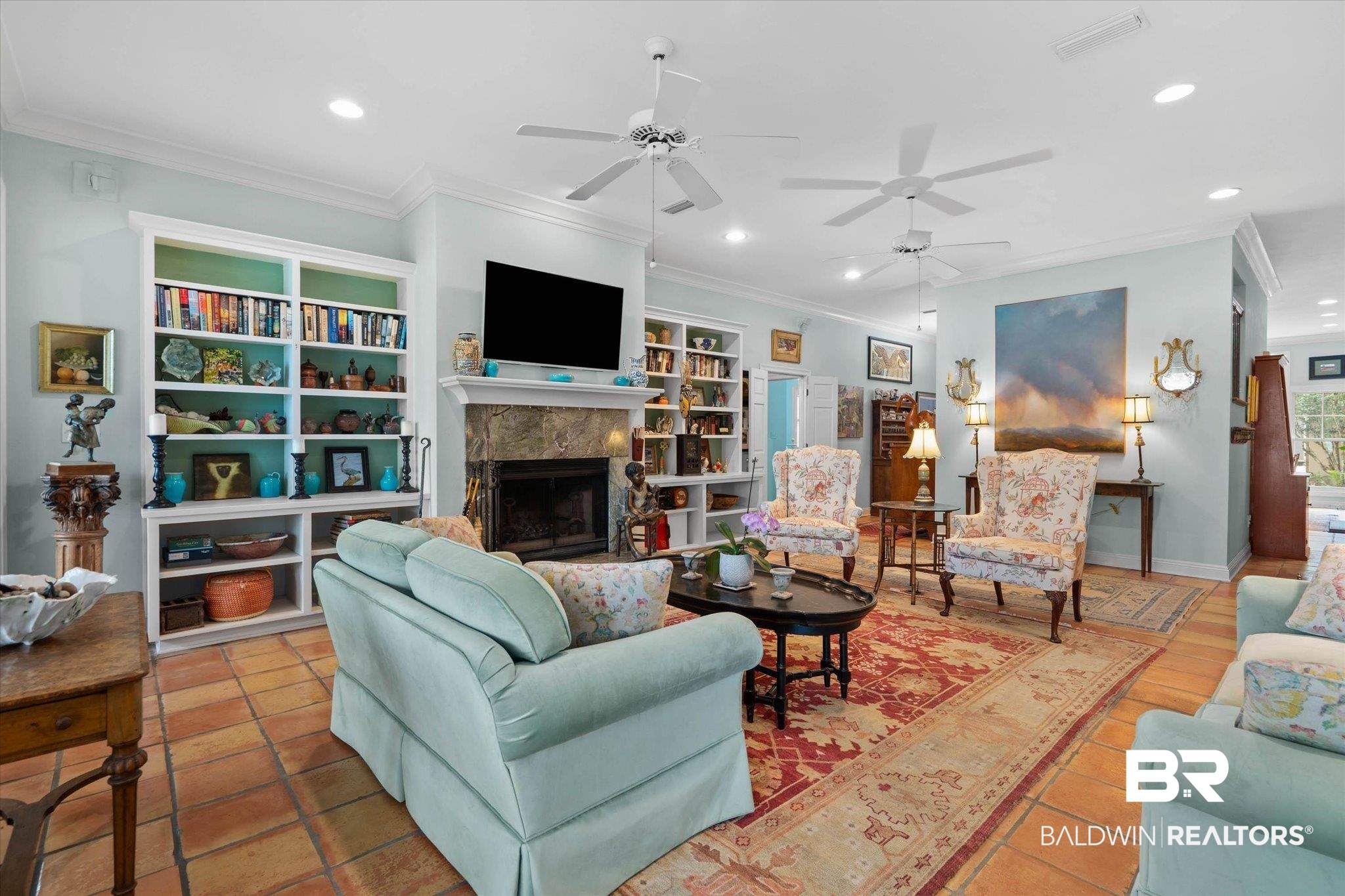 8841 Escambia Avenue Elberta, AL 36530 - Photo 7 of 66 Featuring the fire place and built in book cases.