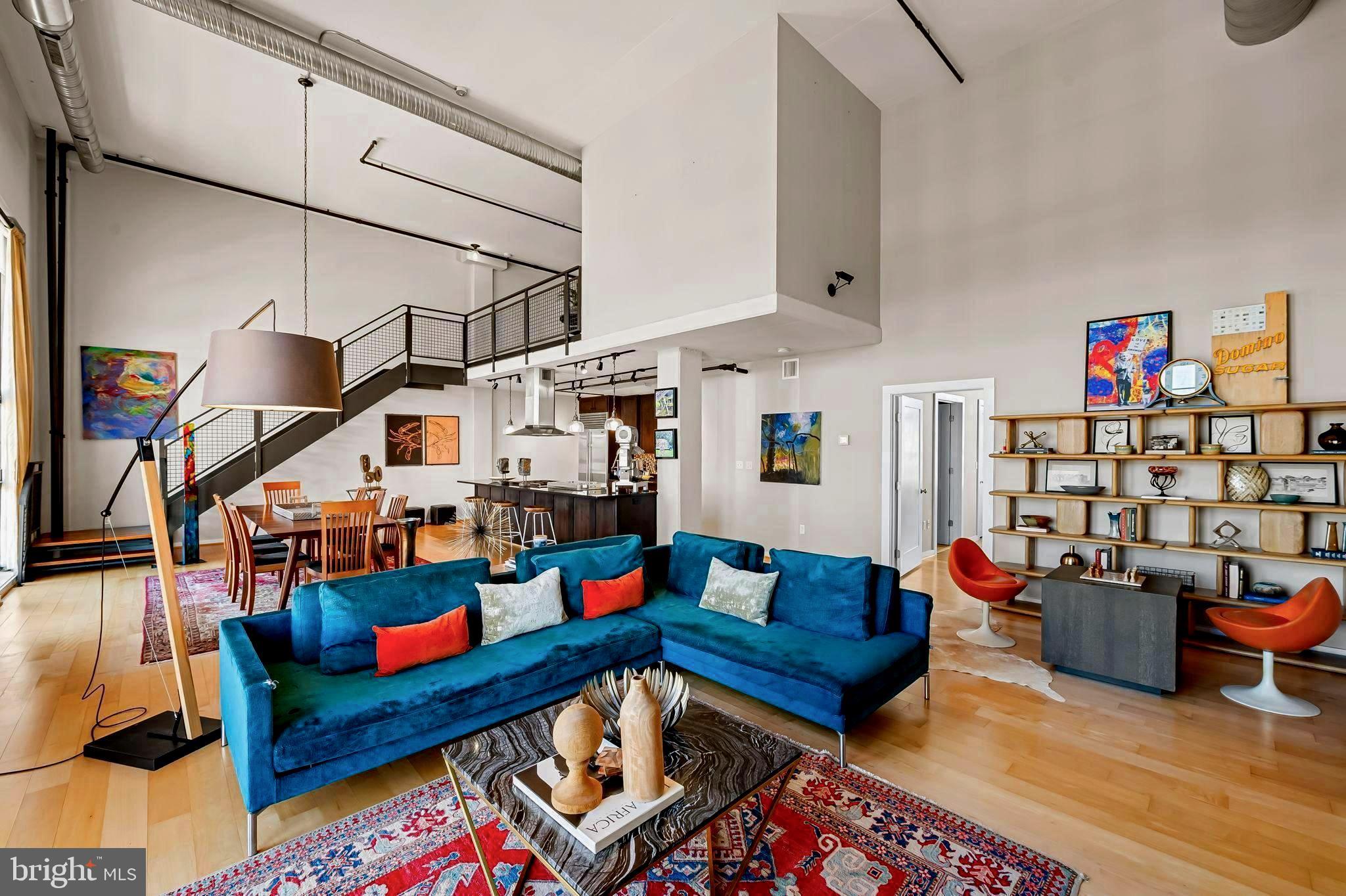 1220 Bank Street, Unit 407 Baltimore, MD 21202 - Photo 11 of 52 a living room with furniture a rug and white walls