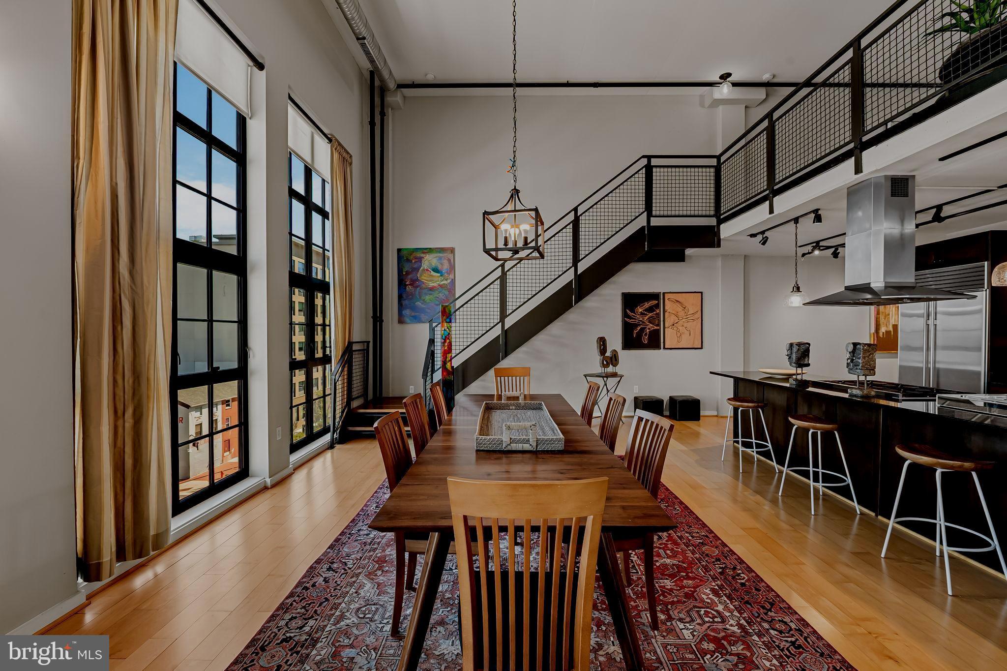 1220 Bank Street, Unit 407 Baltimore, MD 21202 - Photo 13 of 52 a dining room with furniture entryway and wooden floor