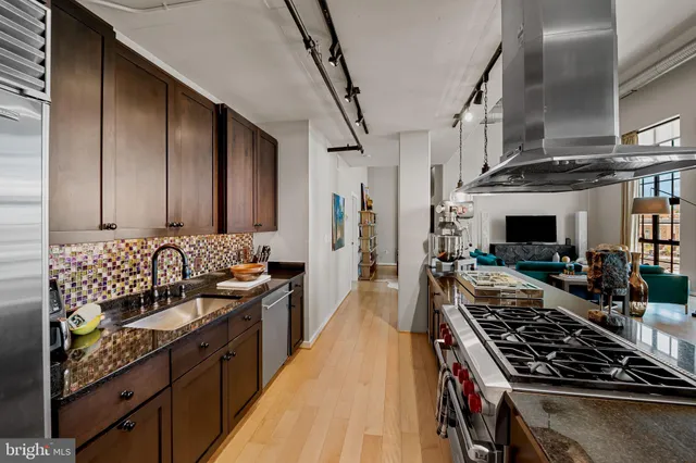 a kitchen with a table and chairs