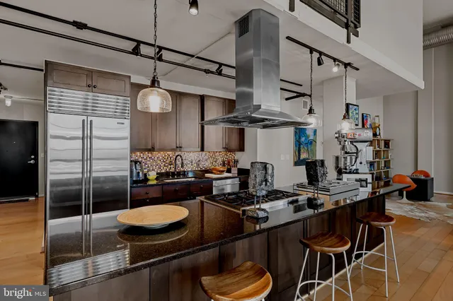 a kitchen with a table and chairs