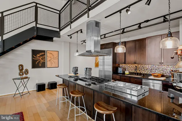 a kitchen with a stove and a refrigerator