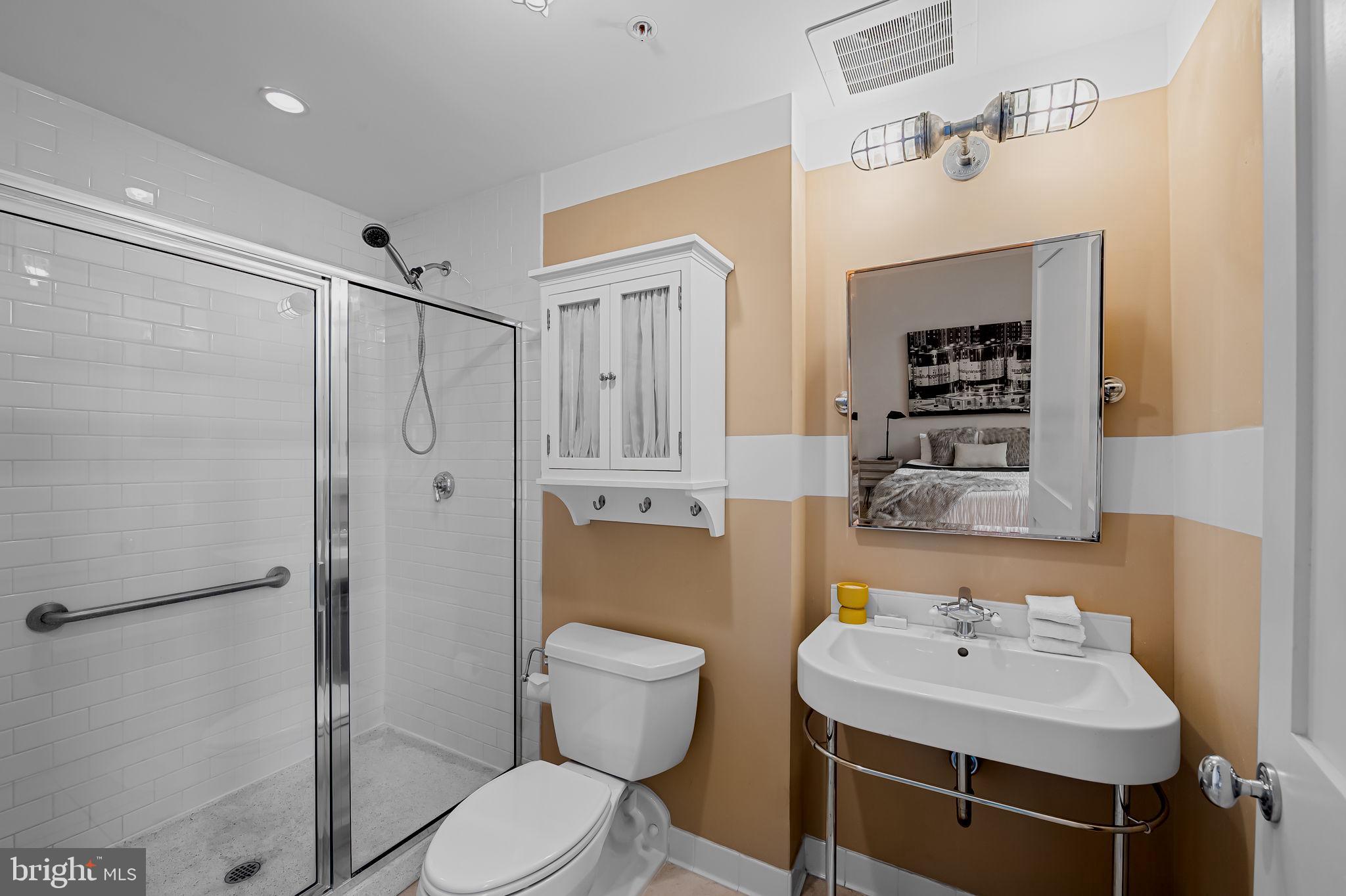 1220 Bank Street, Unit 407 Baltimore, MD 21202 - Photo 28 of 52 a bathroom with a sink toilet and shower