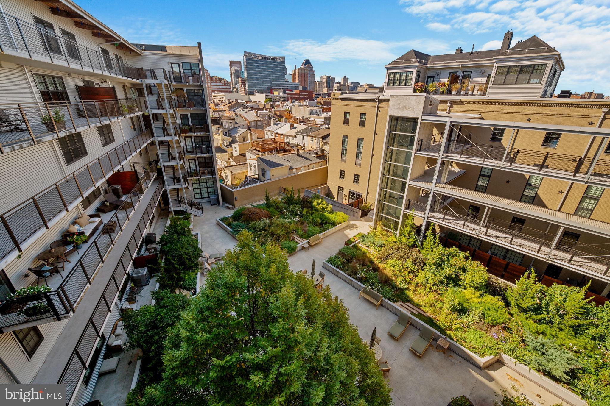 1220 Bank Street, Unit 407 Baltimore, MD 21202 - Photo 40 of 52 an aerial view of a residential building