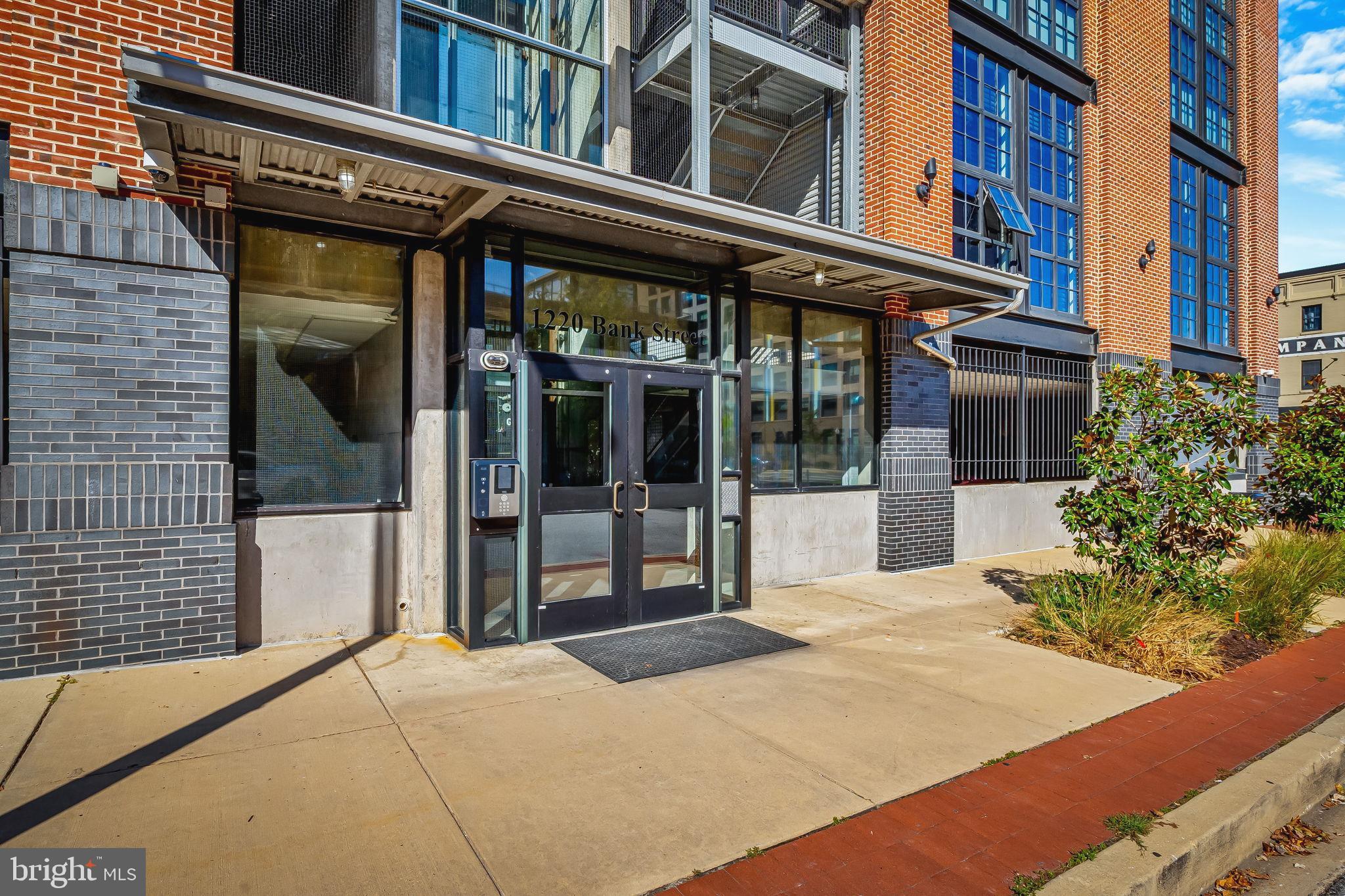 1220 Bank Street, Unit 407 Baltimore, MD 21202 - Photo 48 of 52 a view of a building with a large windows