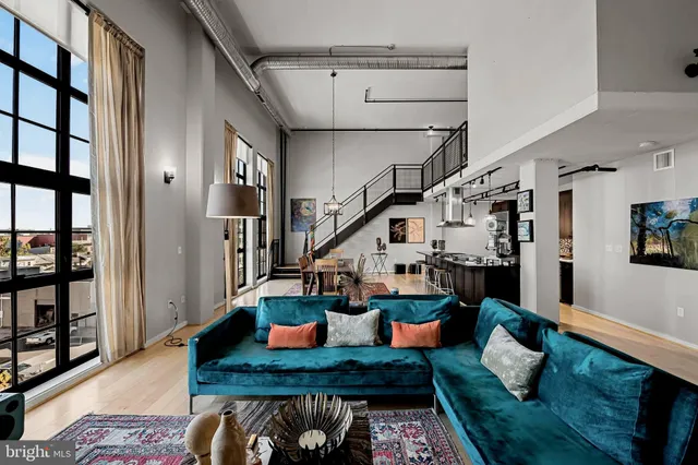 a living room with furniture and a rug