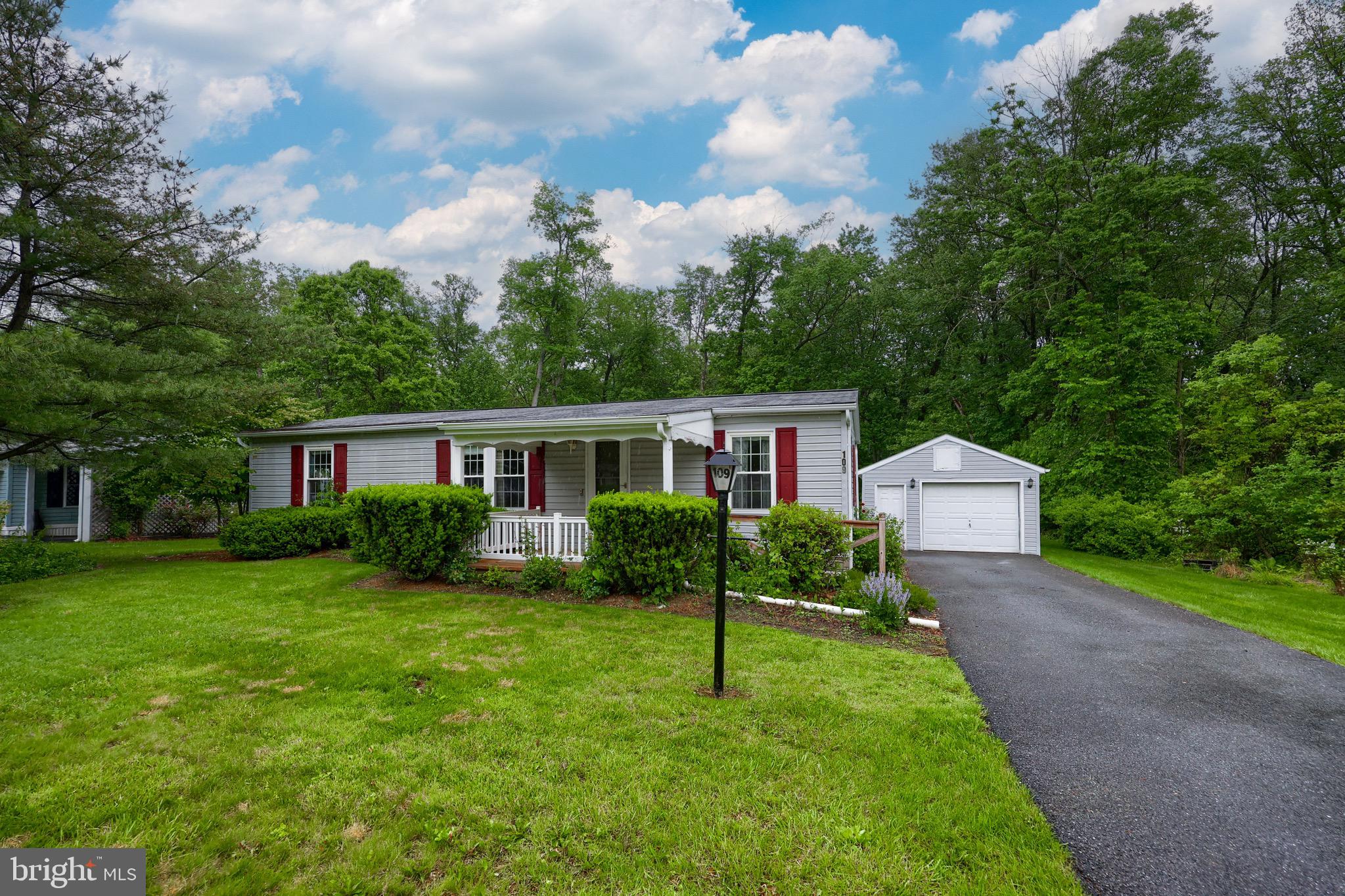 109 Maple Avenue Manheim, PA 17545 - Photo 1 of 39 a front view of a house with a yard and trees