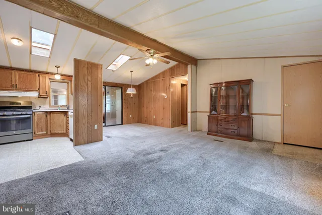 a view of a kitchen with refrigerator and a dishwasher