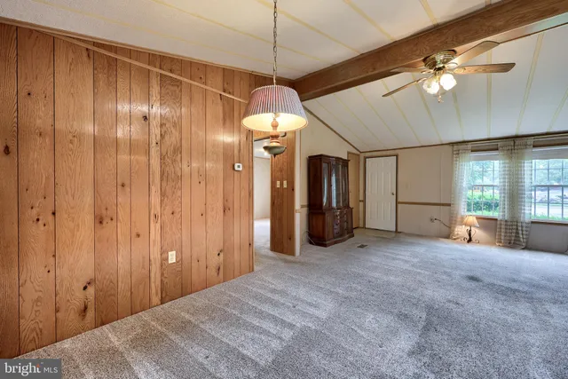 a view of a room with cabinet and mirrors