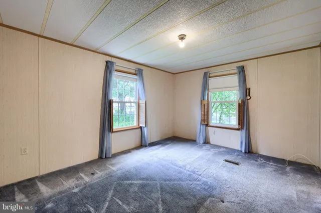 an empty room with closet area